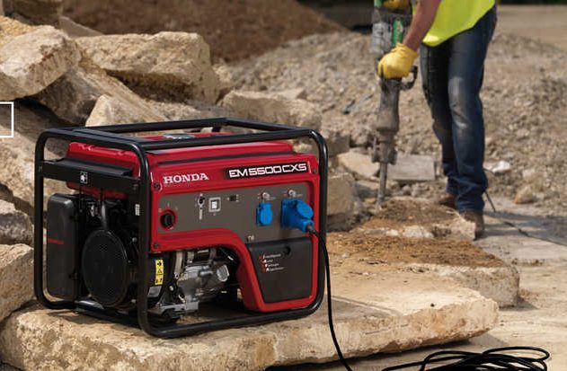 Honda EM5500 generator powering tools on a construction site